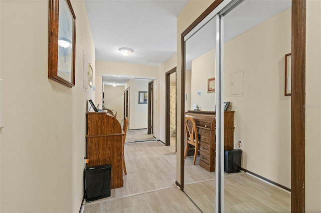 corridor featuring light wood-type flooring