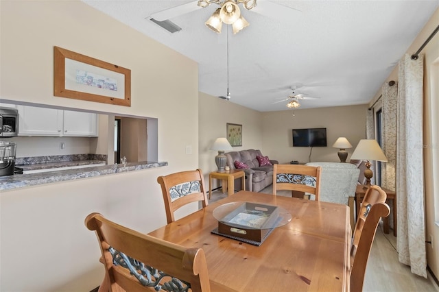 dining room with ceiling fan