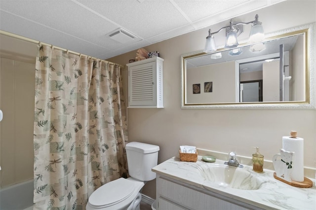 full bathroom featuring vanity, shower / tub combo, and toilet