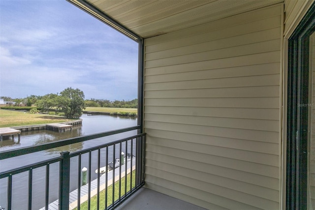 balcony featuring a water view