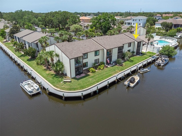 birds eye view of property with a water view