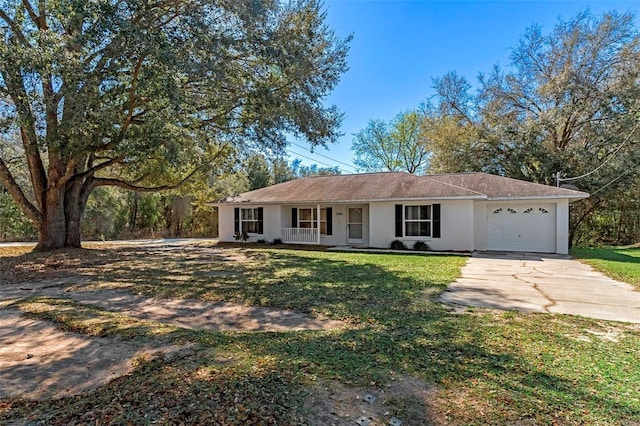 single story home with a garage, covered porch, and a front lawn