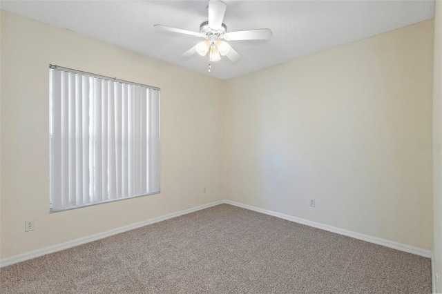 spare room with ceiling fan and carpet flooring