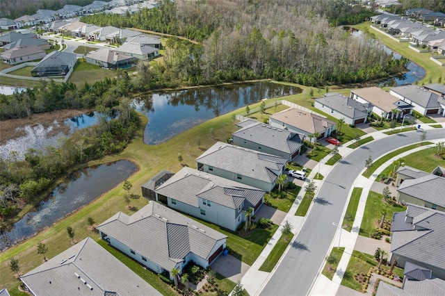 bird's eye view featuring a residential view and a water view