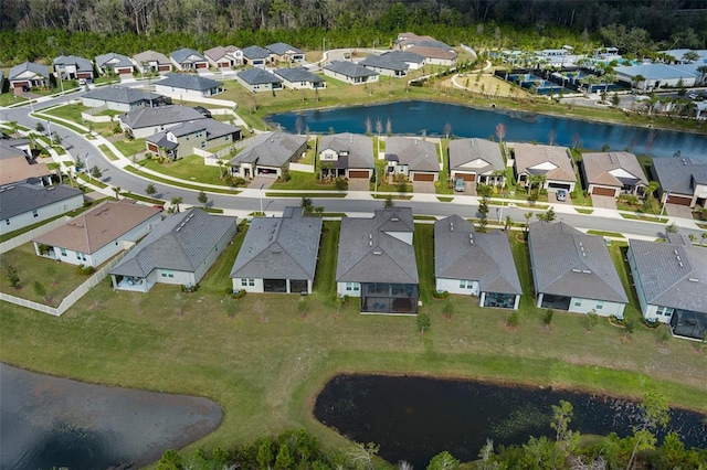 aerial view featuring a residential view and a water view