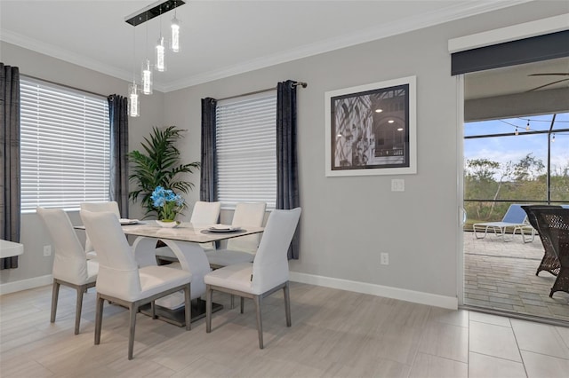 dining space featuring baseboards and ornamental molding