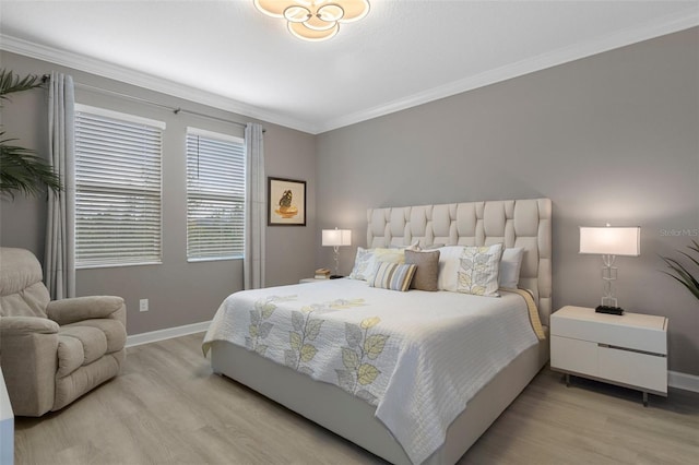 bedroom with baseboards, light wood-type flooring, and ornamental molding