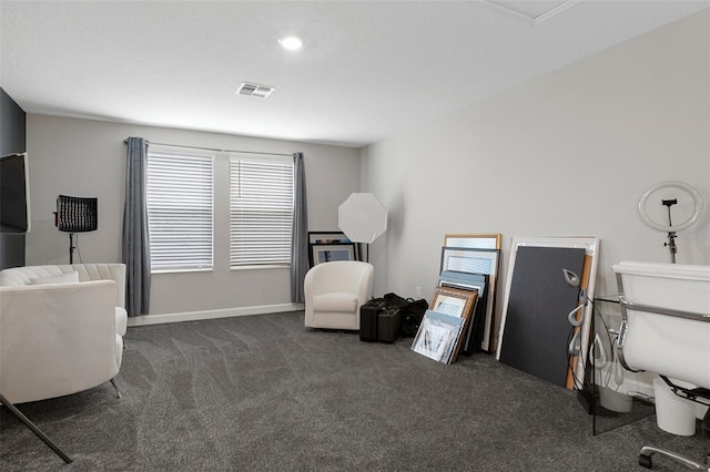 miscellaneous room with visible vents, baseboards, and carpet