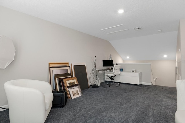 carpeted office featuring visible vents, recessed lighting, and vaulted ceiling