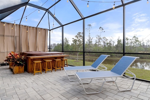 unfurnished sunroom featuring bar