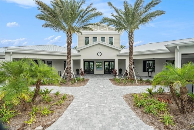 view of property with decorative driveway