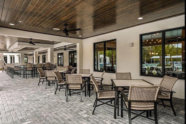 view of patio / terrace with outdoor dining area and ceiling fan