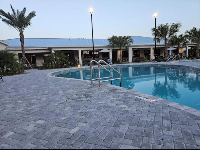 pool featuring a patio area