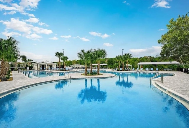 community pool featuring a patio area