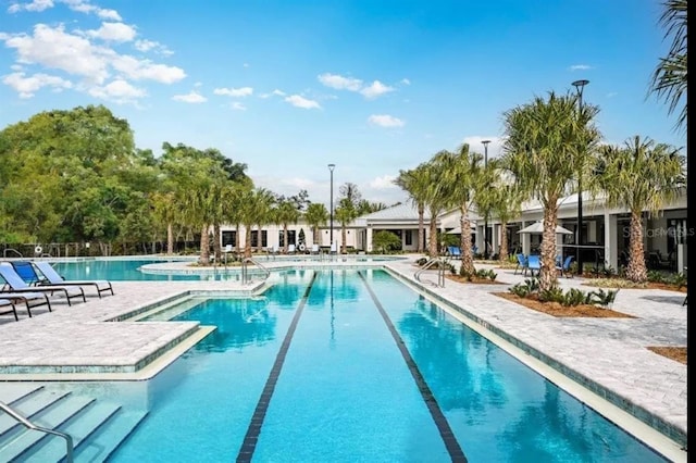 community pool with a patio area