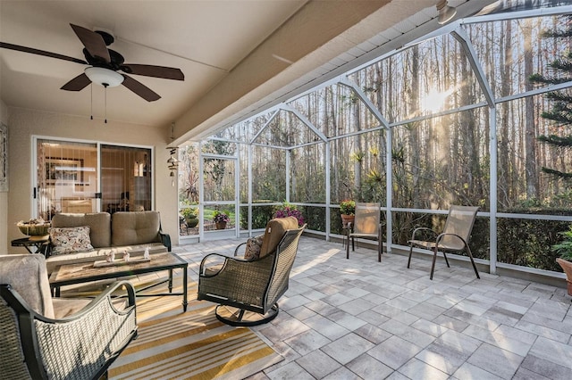 sunroom featuring ceiling fan