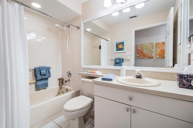 full bathroom featuring vanity, tile patterned floors, shower / bath combo with shower curtain, and toilet