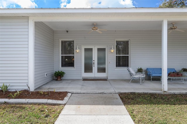 entrance to property featuring french doors, ceiling fan, and a patio