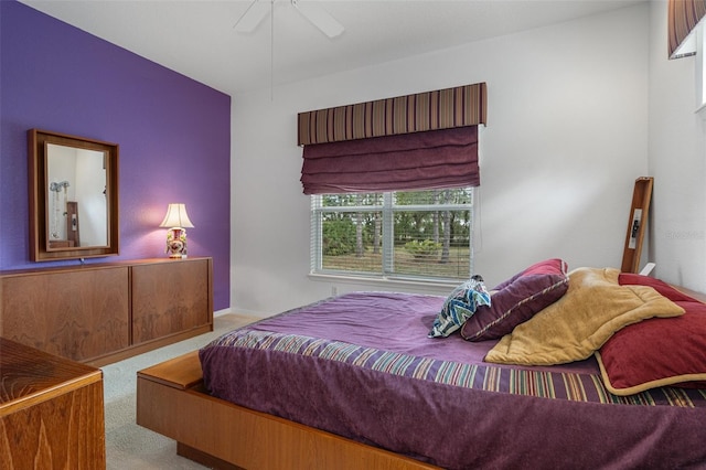 bedroom with light carpet and ceiling fan