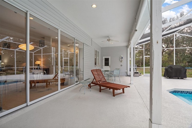 sunroom with a ceiling fan