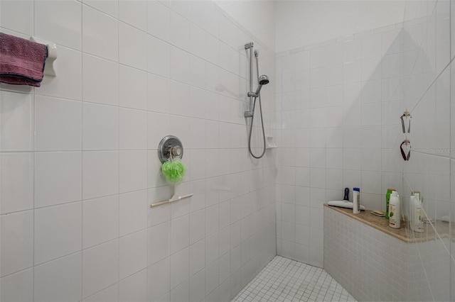 bathroom with a tile shower