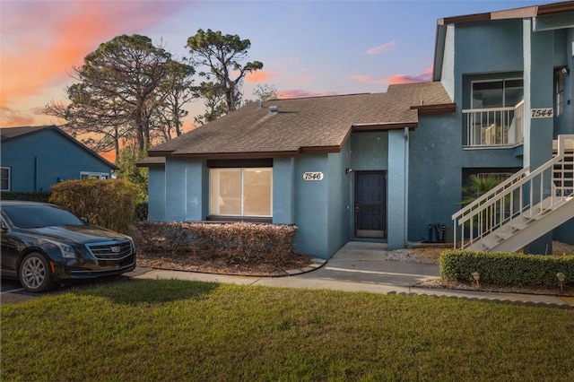 view of front of home with a lawn