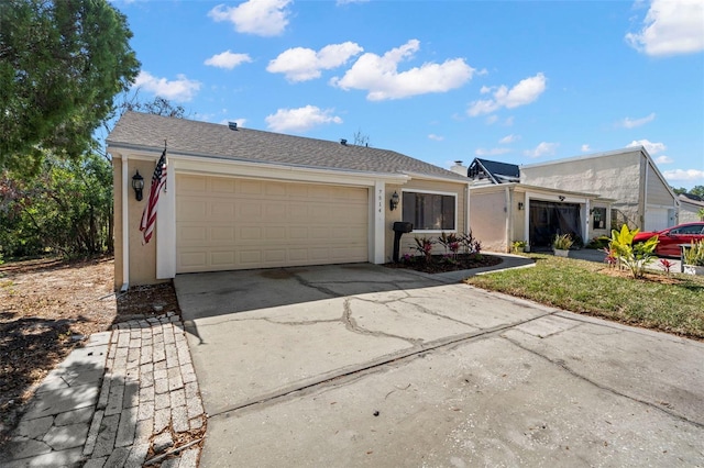 single story home featuring a garage