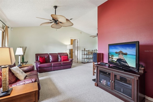 living room with ceiling fan, vaulted ceiling, light carpet, and a textured ceiling