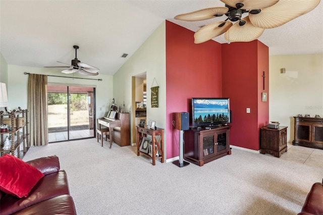 living room with vaulted ceiling, light carpet, and ceiling fan