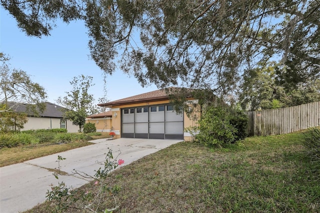 garage featuring a lawn