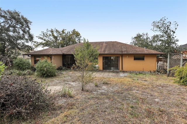 back of property with a patio area