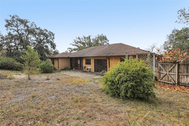 rear view of property featuring a patio