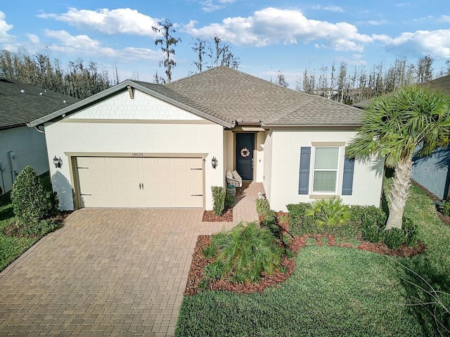 ranch-style home featuring a garage