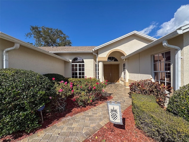 8447 Pavilion Dr, Hudson, FL 34667 - doorway to property featuring stucco siding