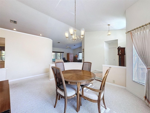 8447 Pavilion Dr, Hudson, FL 34667 - dining area featuring an inviting chandelier, baseboards, lofted ceiling, and visible vents