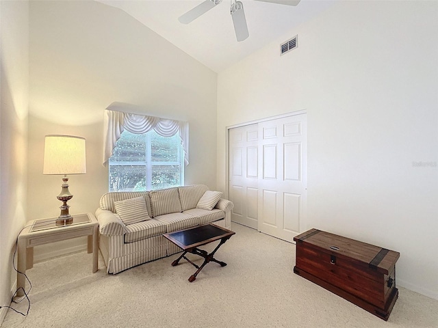 8447 Pavilion Dr, Hudson, FL 34667 - living area with visible vents, high vaulted ceiling, ceiling fan, and carpet