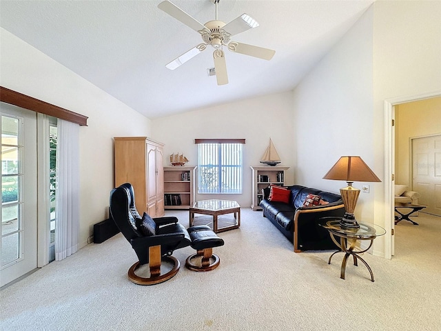 8447 Pavilion Dr, Hudson, FL 34667 - carpeted living room with visible vents, high vaulted ceiling, and ceiling fan