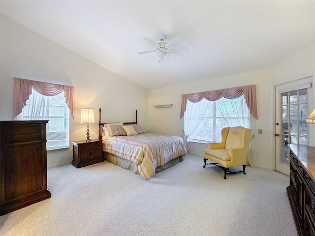 8447 Pavilion Dr, Hudson, FL 34667 - carpeted bedroom with lofted ceiling, a ceiling fan, and access to outside