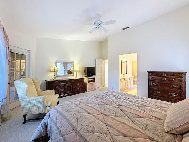 8447 Pavilion Dr, Hudson, FL 34667 - bedroom featuring light colored carpet, visible vents, ensuite bathroom, and a ceiling fan