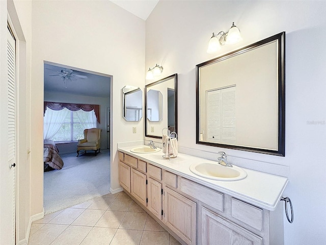 8447 Pavilion Dr, Hudson, FL 34667 - full bathroom with double vanity, connected bathroom, a sink, and tile patterned floors