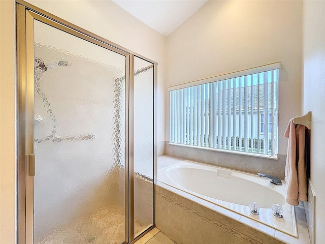 8447 Pavilion Dr, Hudson, FL 34667 - bathroom featuring a stall shower and a garden tub