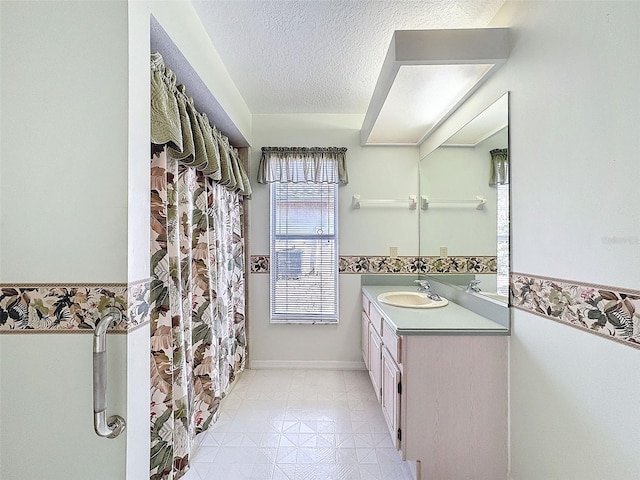8447 Pavilion Dr, Hudson, FL 34667 - bathroom with baseboards, a textured ceiling, and vanity