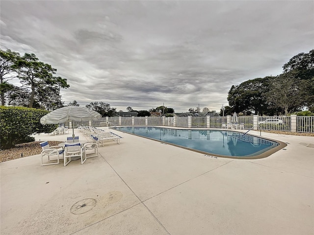 8447 Pavilion Dr, Hudson, FL 34667 - community pool with fence and a patio