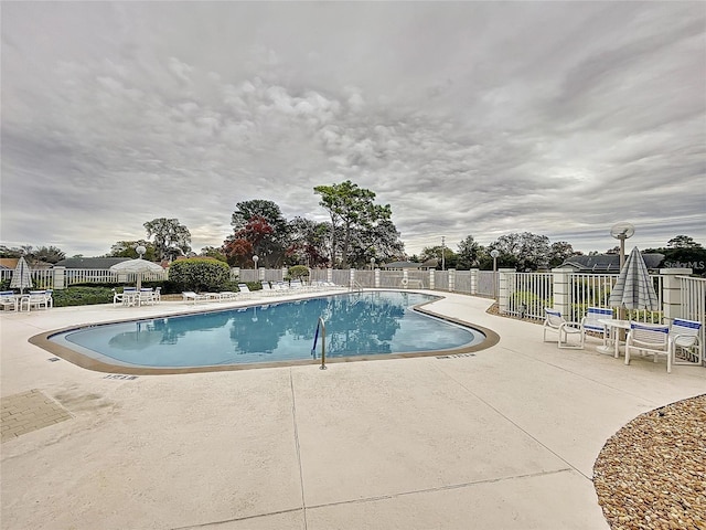 8447 Pavilion Dr, Hudson, FL 34667 - community pool featuring fence and a patio