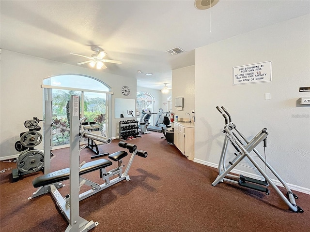 8447 Pavilion Dr, Hudson, FL 34667 - gym with baseboards, visible vents, and a ceiling fan