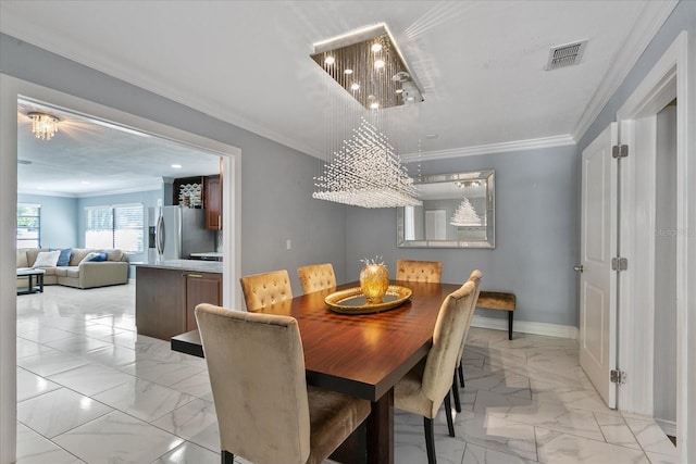 dining space with crown molding