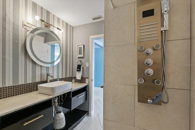 bathroom with vanity and backsplash