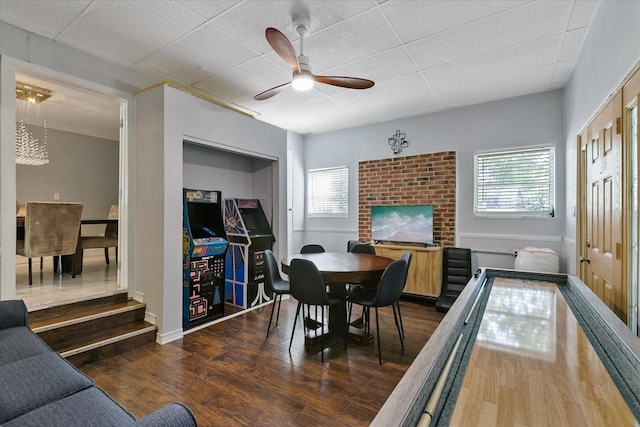 1101 N Betty Ln, Clearwater, FL 33755 - dining room with wood finished floors, a ceiling fan, and a paneled ceiling