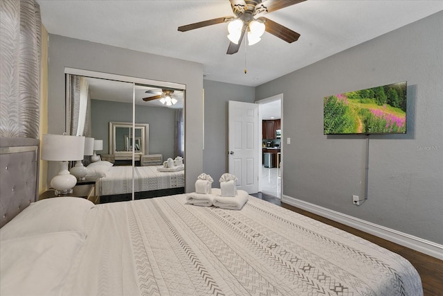 1101 N Betty Ln, Clearwater, FL 33755 - bedroom featuring dark wood-style flooring, a ceiling fan, and a closet