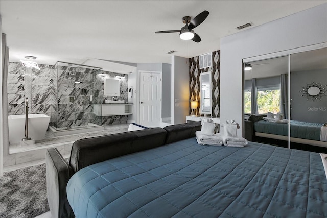 1101 N Betty Ln, Clearwater, FL 33755 - bedroom with ensuite bath and a ceiling fan